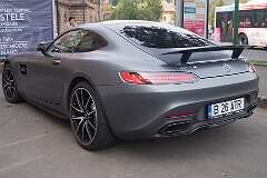 A Mercedes-AMG GT S of 2014 parked in front of the Banca Comercială Română on Bulevardul Eroilor in Braşov, Romania.
