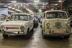 A Fiat Abarth OT 1000 of 1964, based on the Fiat 850,  and a Fiat 600 Multipla of 1957 in Abarth livery in the main hall of the Abarth Works Museum in Lier.