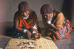 Bethany, Eswatini, 1970 - Reading the “ematsambo” or “bones” by a Swazi “sangoma” or diviner: the way they fell on the mat shows the solution to a problem.