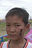 Choibalsan, Dornod, Mongolia, 2011 - A boy, the word “Mongolia” on his cheek.