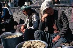 A man is selling biscuits on a street market along busy Jadi Maiwand, the main avenue of Kabul.