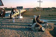On the road in Afghanistan: Afternoon prayers along the road near Khash Rud, not far from Kandahar. The bus stopped here to give people opportunity to fulfil their religious obligations