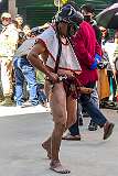 Masked dancer with large wooden phallus, in the Carnival Parade on the first day of the Tawang Festival.