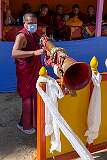A monk dismantling a “dungchen”, a long horn, at the end of the Torgya, at the Monastery in Bomdila.