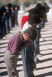 Children praying at Lamdon Model School assembly.