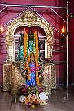 Kali, depicted as a multi-armed goddess: her many arms represent her omnipotence, the ability to perform multiple tasks simultaneously, and her power to defeat multiple enemies at once.