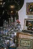 Ceramics for sale in the bazaar of Isfahan. On the wall are portraits of the prophet Ali and Reza Pahlavi, crown prince and heir to the throne of Iran.