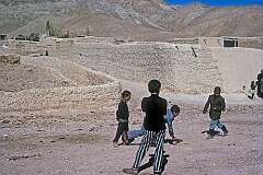Children playing marbles in a viallage along the 306 kilometre long road between Gorgan and Bojnurd.