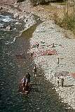Women washing carpets in the river, Alborz Province, along the road to  Chalus.