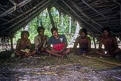 Young men taking a break from collecting copra in the canoe shed at the south point of Onne island, the southernmost point of Makin atoll.