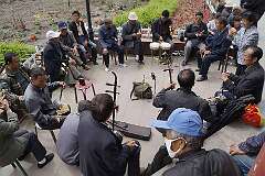 Ürümqi, Xinjiang-Uyghur, China, 2013 - Traditional Chinese music in People's Park.