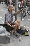 Beijing, China, 2011 - Singing and playing a “huqin” fiddle.
