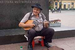 Novi Sad, Vojvodina, Serbia, 2018 - A street musician on Trg Slobode (Liberty Square).