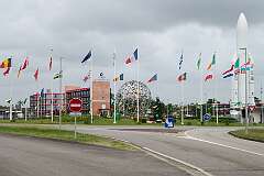 Entrance to the Centre Spatial Guyanais, with an Ariane rocket and flags of the participating countries in the European Space Agency, Kourou, French Guyana, 2016.