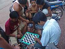 Hpa-an, Kayin State, Myanmar, 2006 - Karen boys playing a game of checkers.