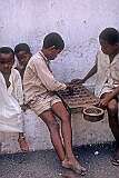 Domoni, Nzwani, Comoros, 1972 - Playing “Bao Kiswahili bao bau” game.