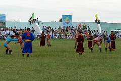 Darkhan, Mongolia, 2011 - A “Bökh” Mongolian wrestling tournament at the local Naadam Festival, watched by the wrestlers' “Zasuul”, their guide and coach.
