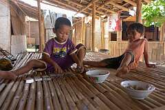 Santolo, Jawa Barat, Indonesia, 2010 - Playing a card game, near Pameungpeuk, western Java.