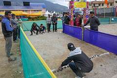 Tawang, Arunachal Pradesh, India, 2023 - Monpa men playing “Lei”, a traditional game, at the Tawang Festival.