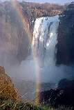 Victoria Falls, Matabeleland North, Zimbabwe - Devil's Cataract with, on the Zambian side, the statue of Dr. David Livingstone.