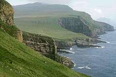 Mykines, Faroe Islands - The south coast of Mykines island, looking east towards Vágar.